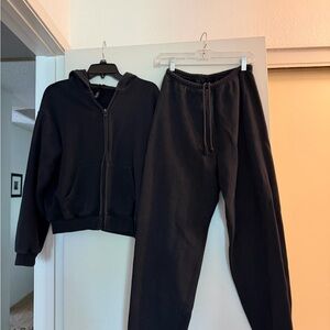 SKIMS Black Cozy Fleece Zip Hoodie and joggers
